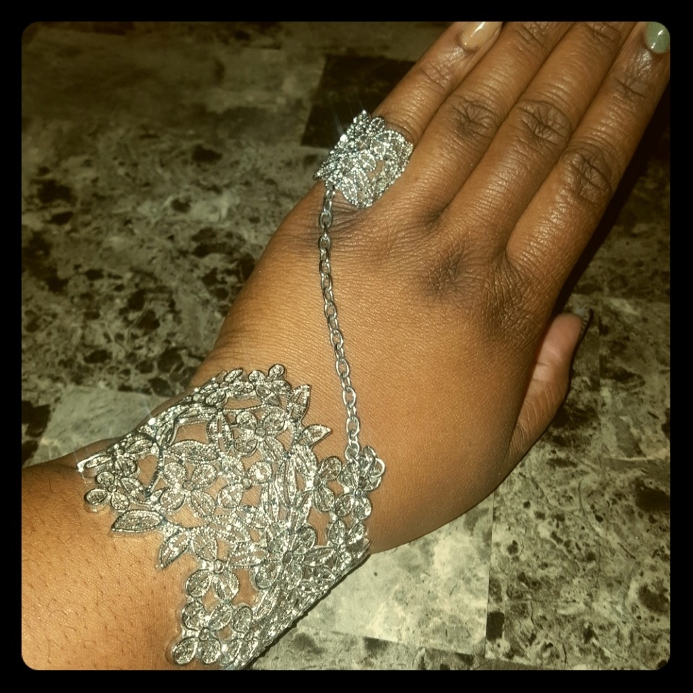 Silver Bracelet with attached ring.